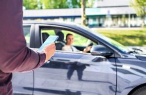 Lady driver picking up uber passenger.