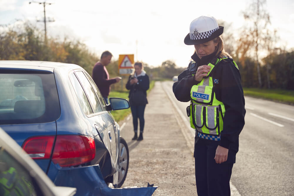 Policewoman reported car accident.