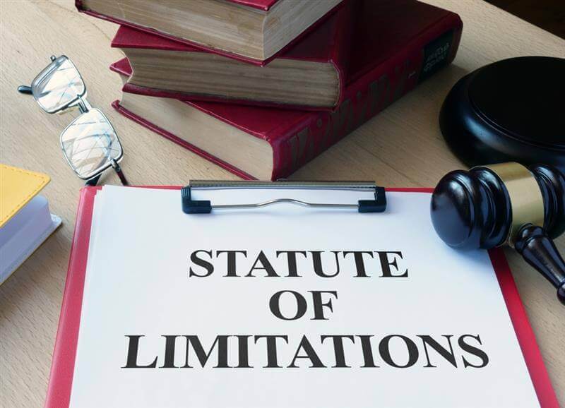 Statute of limitations text document on the table.